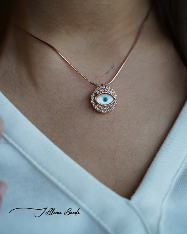 Gazing evil eye rose gold necklace