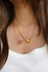 Circular studded initial necklace