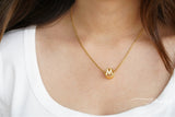 Circular studded initial necklace